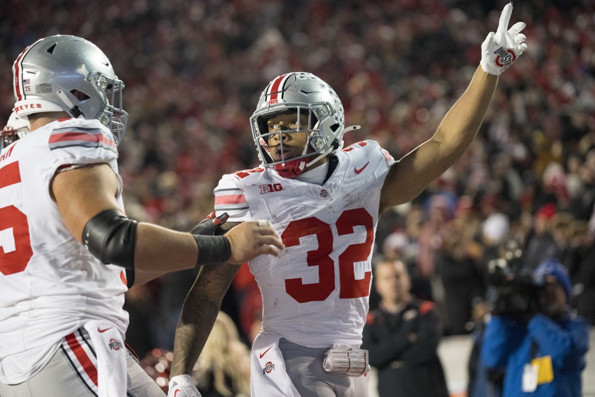 Oct 28, 2023; Madison, Wisconsin, USA; Ohio State Buckeyes running back TreVeyon Henderson (32) celebrates after scoring a touchdown during the fourth quarter against the Wisconsin Badgers at Camp Randall Stadium.